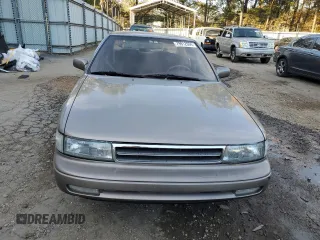 1990 Nissan Maxima z VIN JN1HJ01P3LT393901, wystawiony jako Copart lot #79912694 z przebiegiem 127 678 mil mil oraz Szkody całkowita. Historia ofert i sprzedaży dostępna na DreamBid. Obrazek 5.
