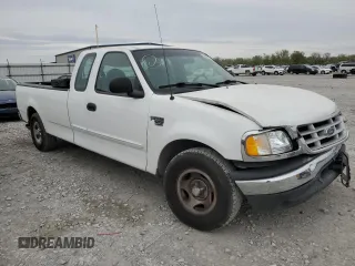1999 Ford F-150 with VIN 2FTRX17W3XCA68816, listed as a Copart auction lot 53080755 with 201,501 mi miles and Salvage Title. Bid and sale history available at DreamBid. Image 4.