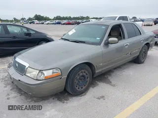 2003 Mercury Grand Marquis GS Convenience z VIN 2MEFM74W83X678151, wystawiony jako IAAI lot #42393410 z przebiegiem 273 966 mil mil oraz . Historia ofert i sprzedaży dostępna na DreamBid. Obrazek 2.