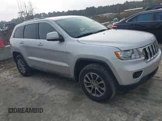 2012 Jeep Grand Cherokee Laredo with VIN 1C4RJFAG7CC189381, listed as a IAAI auction lot 41429085 with 137,238 mi miles. Bid and sale history available at carsss.com. Image 1.