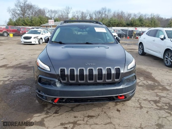 2015 Jeep Cherokee Trailhawk with VIN 1C4PJMBS8FW702624, listed as a IAAI auction lot 41828049 with 87,407 mi miles. Bid and sale history available at carsss.com. Image 13.