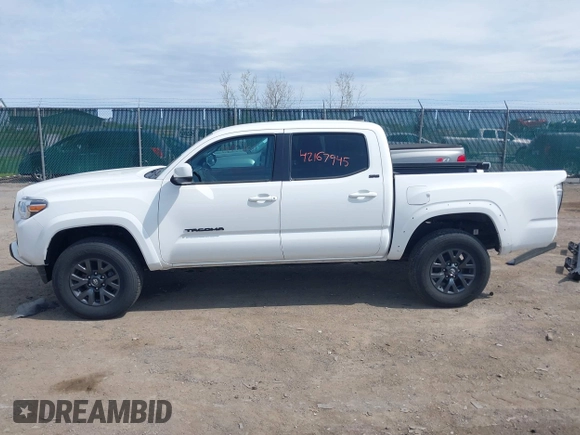 2023 Toyota Tacoma SR with VIN 3TMCZ5AN2PM642205, listed as a IAAI auction lot 42167945 with 10,595 mi miles and . Bid and sale history available at DreamBid. Image 15.