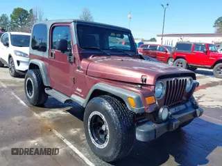2003 Jeep Wrangler Sport with VIN 1J4FA49S33P345192, listed as a IAAI auction lot 41801344 with 196,472 mi miles. Bid and sale history available at carsss.com. Image 1.