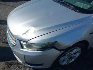 2013 Ford Taurus SEL with VIN 1FAHP2E8XDG164903, listed as a IAAI auction lot 41580690 with 163,128 mi miles and . Bid and sale history available at carsss.com. Image 6.