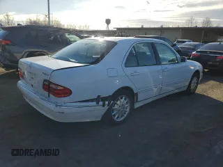 2000 Mercedes-Benz E-Class AWD with VIN WDBJF82G1YX028712, listed as a Copart auction lot 43983315 with 201,037 mi miles and Salvage Title. Bid and sale history available at carsss.com. Image 3.