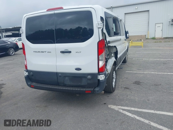 2020 Ford Transit Passenger XL with VIN 1FBAX2Y87LKA09619, listed as a IAAI auction lot 42743359 with 79,822 mi miles and . Bid and sale history available at DreamBid. Image 4.