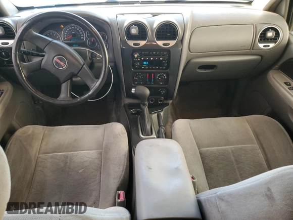 2005 GMC Envoy SLT with VIN 1GKDS13S652339845, listed as a Copart auction lot 77693684 with 220,306 mi miles and Salvage Title. Bid and sale history available at carsss.com. Image 8.