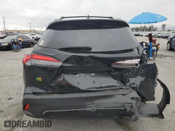 2024 Toyota Corolla Cross XLE with VIN 7MUDAAAG8RV095021, listed as a Copart auction lot 59232265 with 7,010 mi miles and Salvage title. Bid and sale history available at DreamBid. Image 6.