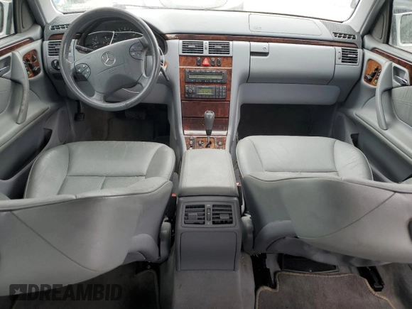 2000 Mercedes-Benz E 320 with VIN WDBJF65J1YB099417, listed as a Copart auction lot 54656915 with 130,387 mi miles and Salvage Title. Bid and sale history available at DreamBid. Image 8.