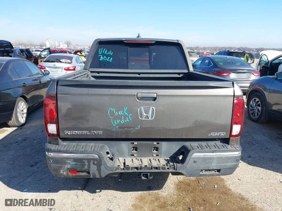 2020 Honda Ridgeline RTL-E with VIN 5FPYK3F72LB011694, listed as a IAAI auction lot 41628184 with 76,011 mi miles. Bid and sale history available at carsss.com. Image 16.