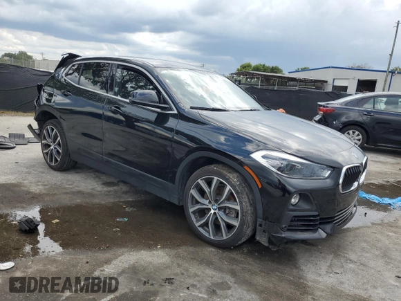 2020 BMW X2 sDrive28i with VIN WBXYH9C05L5R39182, listed as a Copart auction lot 56929605 with 87,253 mi miles and Non repairable. Bid and sale history available at DreamBid. Image 4.