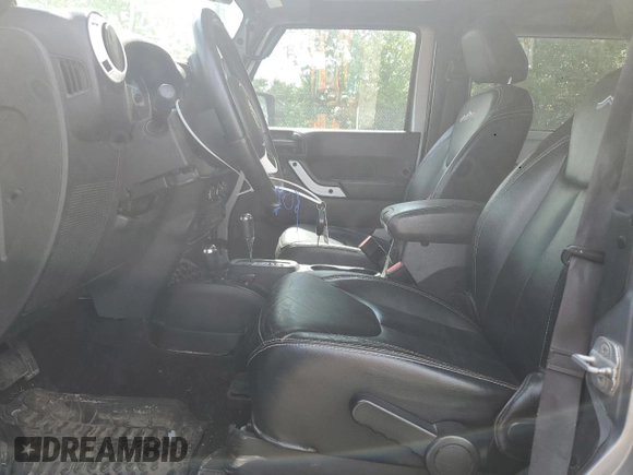 2014 Jeep Wrangler Sahara with VIN 1C4AJWBG0EL241643, listed as a Copart auction lot 56491155 with 113,596 mi miles and Salvage title. Bid and sale history available at DreamBid. Image 7.