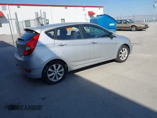 2012 Hyundai Accent SE with VIN KMHCU5AE0CU021092, listed as a IAAI auction lot 41789027 with 137,557 mi miles. Bid and sale history available at carsss.com. Image 4.