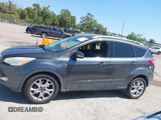 2016 Ford Escape Titanium with VIN 1FMCU0J95GUB11995, listed as a IAAI auction lot 42065255 with 142,390 mi miles. Bid and sale history available at carsss.com. Image 14.
