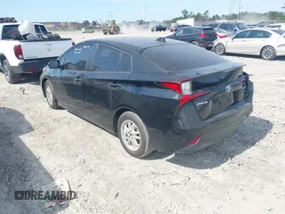 2021 Toyota Prius L Eco z VIN JTDKAMFU6M3141392, wystawiony jako IAAI lot #42317866 z przebiegiem 137 495 mil mil oraz . Historia ofert i sprzedaży dostępna na DreamBid. Obrazek 3.