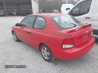 2002 Hyundai Accent GL with VIN KMHCG35C32U157056, listed as a IAAI auction lot 41538381 with 127,518 mi miles. Bid and sale history available at carsss.com. Image 3.