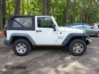 2012 Jeep Wrangler Sport with VIN 1C4AJWAG7CL192200, listed as a IAAI auction lot 42472398 with 198,999 mi miles and . Bid and sale history available at DreamBid. Image 13.