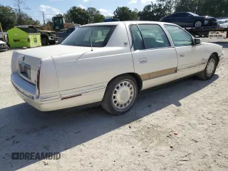 1999 Cadillac DeVille z VIN 1G6KD54YXXU794473, wystawiony jako Copart lot #79774804 z przebiegiem 44 601 mil mil oraz Czysty tytuł • Clean title. Historia ofert i sprzedaży dostępna na DreamBid. Obrazek 3.