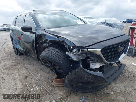 2022 Mazda CX-9 Touring Plus z VIN JM3TCBAYXN0613830, wystawiony jako IAAI lot #41942849 z przebiegiem 50 193 mil mil oraz . Historia ofert i sprzedaży dostępna na DreamBid. Obrazek 1.