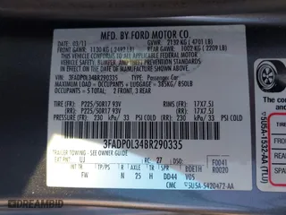 2011 Ford Fusion Hybrid with VIN 3FADP0L34BR290335, listed as a IAAI auction lot 42094674 with 171,391 mi miles. Bid and sale history available at carsss.com. Image 9.