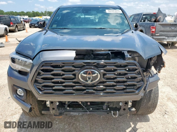 2023 Toyota Tacoma SR z VIN 3TMCZ5AN5PM598443, wystawiony jako Copart lot #60485035 z przebiegiem 18 842 mil mil oraz Szkoda całkowita • Salvage title. Historia ofert i sprzedaży dostępna na DreamBid. Obrazek 5.