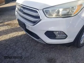 2017 Ford Escape SE z VIN 1FMCU0GD4HUC98854, wystawiony jako IAAI lot #42558269 z przebiegiem 62 975 mil mil oraz . Historia ofert i sprzedaży dostępna na DreamBid. Obrazek 22.