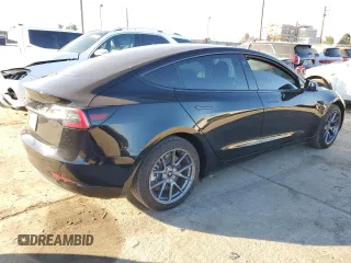 2021 Tesla Model 3 Standard Range Plus with VIN 5YJ3E1EA5MF082272, listed as a Copart auction lot 88724475 with 22,613 mi miles and Salvage Title. Bid and sale history available at carsss.com. Image 3.
