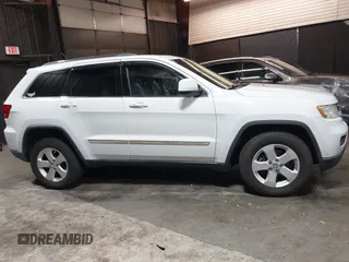 2013 Jeep Grand Cherokee Laredo with VIN 1C4RJFAG9DC532919, listed as a IAAI auction lot 40918828 with 140,093 mi miles. Bid and sale history available at carsss.com. Image 13.