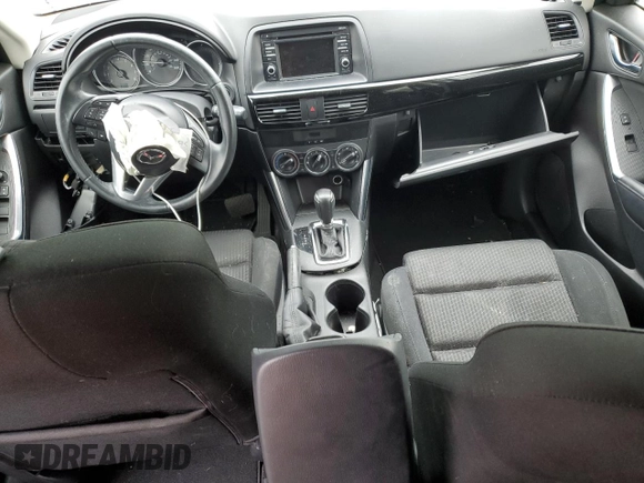 2014 Mazda CX-5 Touring z VIN JM3KE4CYXE0426408, wystawiony jako Copart lot #57355115 z przebiegiem Nie podano mil oraz Szkody całkowita. Historia ofert i sprzedaży dostępna na DreamBid. Obrazek 8.
