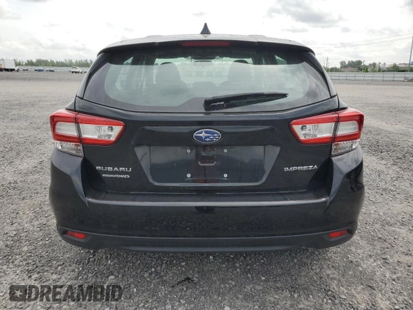 2018 Subaru Impreza with VIN 4S3GTAF65J1751579, listed as a Copart auction lot 61690535 with 77,316 mi miles and Salvage title. Bid and sale history available at DreamBid. Image 6.