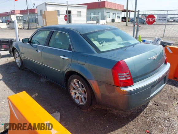 2006 Chrysler 300 C with VIN 2C3KA63H76H141246, listed as a IAAI auction lot 42035339 with 208,798 mi miles. Bid and sale history available at carsss.com. Image 3.