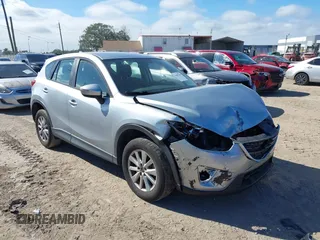 2016 Mazda CX-5 Sport with VIN JM3KE2BE9G0915168, listed as a IAAI auction lot 41482749 with 86,802 mi miles and . Bid and sale history available at carsss.com. Image 1.