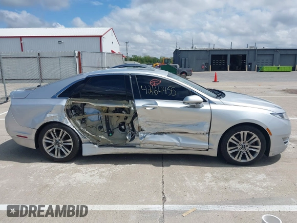 2015 Lincoln MKZ z VIN 3LN6L2GK5FR622117, wystawiony jako IAAI lot #42164455 z przebiegiem 167 156 mil mil oraz . Historia ofert i sprzedaży dostępna na DreamBid. Obrazek 13.