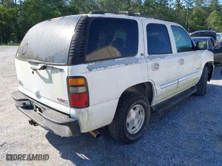 2005 GMC Yukon SLT with VIN 1GKEC13T15J147023, listed as a IAAI auction lot 41993666 with 250,216 mi miles. Bid and sale history available at carsss.com. Image 4.