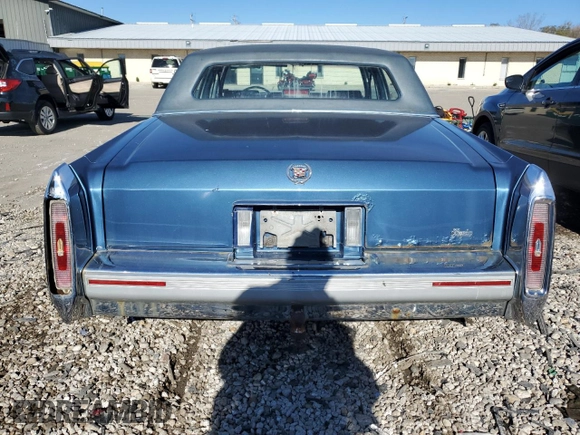 1992 Cadillac Brougham z VIN 1G6DW54E7NR707492, wystawiony jako Copart lot #79950214 z przebiegiem 263 624 mil mil oraz Tytuł czysty. Historia ofert i sprzedaży dostępna na DreamBid. Obrazek 6.