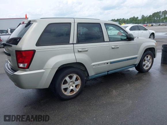 2008 Jeep Grand Cherokee Laredo with VIN 1J8GS48K58C105108, listed as a IAAI auction lot 42068055 with 201,272 mi miles. Bid and sale history available at carsss.com. Image 4.