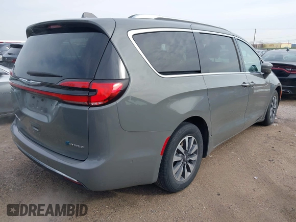2021 Chrysler Pacifica Hybrid Touring L z VIN 2C4RC1L78MR596371, wystawiony jako IAAI lot #39993913 z przebiegiem 64 830 mil mil oraz . Historia ofert i sprzedaży dostępna na DreamBid. Obrazek 4.