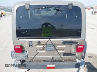 2006 Jeep Wrangler Sport Right Hand Drive with VIN 1J4F449S46P716520, listed as a IAAI auction lot 41763887 with 236,816 mi miles. Bid and sale history available at carsss.com. Image 6.