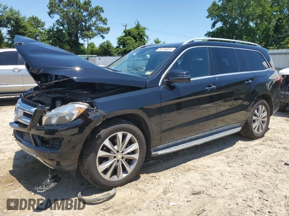 2015 Mercedes-Benz GL with VIN 4JGDF6EE1FA562088, listed as a Copart auction lot 58736934 with 104,550 mi miles and Salvage Title. Bid and sale history available at carsss.com. Image 1.