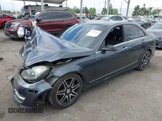 2014 Mercedes-Benz C C 250 Sport with VIN WDDGF4HB6ER317333, listed as a IAAI auction lot 42127437 with 128,010 mi miles. Bid and sale history available at carsss.com. Image 2.