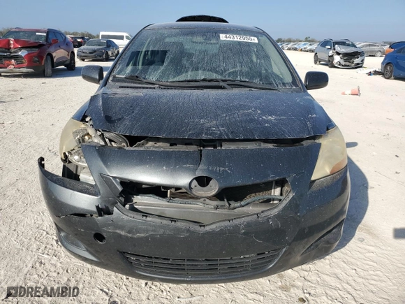 2011 Toyota Yaris with VIN JTDBT4K33B1404938, listed as a Copart auction lot 44312955 with 0 mi miles and Salvage Title. Bid and sale history available at carsss.com. Image 5.