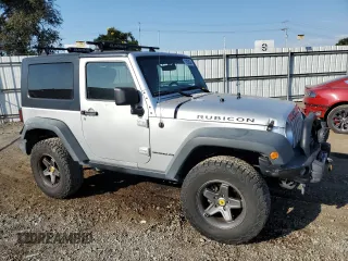 2009 Jeep Wrangler Rubicon with VIN 1J4GA64149L757121, listed as a Copart auction lot 74258934 with 73,241 mi miles and Salvage Title. Bid and sale history available at DreamBid. Image 4.