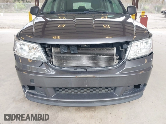 2015 Dodge Journey SE z VIN 3C4PDCAB1FT617794, wystawiony jako IAAI lot #41922371 z przebiegiem 130 558 mil mil oraz . Historia ofert i sprzedaży dostępna na DreamBid. Obrazek 6.