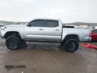 2018 Toyota Tacoma SR with VIN 5TFGZ5AN4JX142565, listed as a IAAI auction lot 41353718 with 87,544 mi miles and . Bid and sale history available at carsss.com. Image 14.