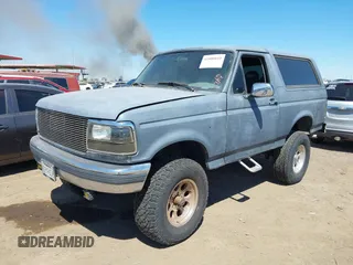 1995 Ford Bronco Custom with VIN 1FMEU15H5SLB65909, listed as a IAAI auction lot 41880810 with 216,927 mi miles. Bid and sale history available at carsss.com. Image 2.