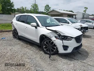 2016 Mazda CX-5 Grand Touring z VIN JM3KE4DY7G0746352, wystawiony jako IAAI lot #42108522 z przebiegiem 130 795 mil mil oraz . Historia ofert i sprzedaży dostępna na DreamBid. Obrazek 1.