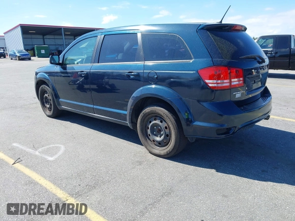 2014 Dodge Journey American Value Pkg with VIN 3C4PDCAB4ET103534, listed as a IAAI auction lot 41805531 with 175,310 mi miles. Bid and sale history available at carsss.com. Image 3.