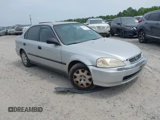 1999 Honda Civic LX z VIN 1HGEJ6677XL015230, wystawiony jako IAAI lot #41985703 z przebiegiem 253 402 mil mil oraz . Historia ofert i sprzedaży dostępna na DreamBid. Obrazek 1.