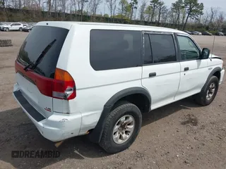 1998 Mitsubishi Montero LS z VIN JA4MT31P1WP032729, wystawiony jako IAAI lot #42040307 z przebiegiem 172 602 mil mil oraz . Historia ofert i sprzedaży dostępna na DreamBid. Obrazek 4.
