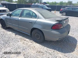 2005 Pontiac Grand Am SE with VIN 1G2NE52E95M131462, listed as a IAAI auction lot 41964139 with 273,443 mi miles. Bid and sale history available at carsss.com. Image 3.